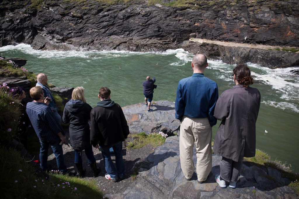 People standing on a cliff edge