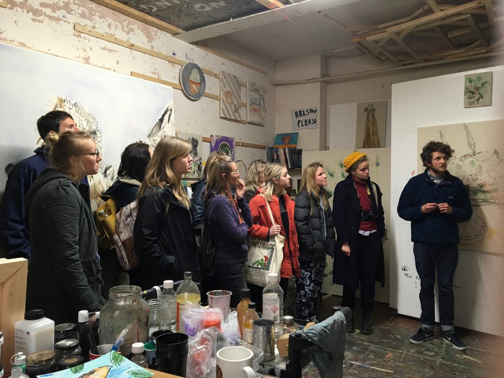 Students viewing an artist's studio