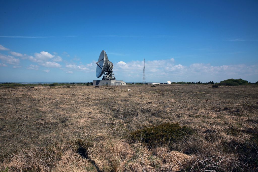 Earth station satellite dish in the landscape