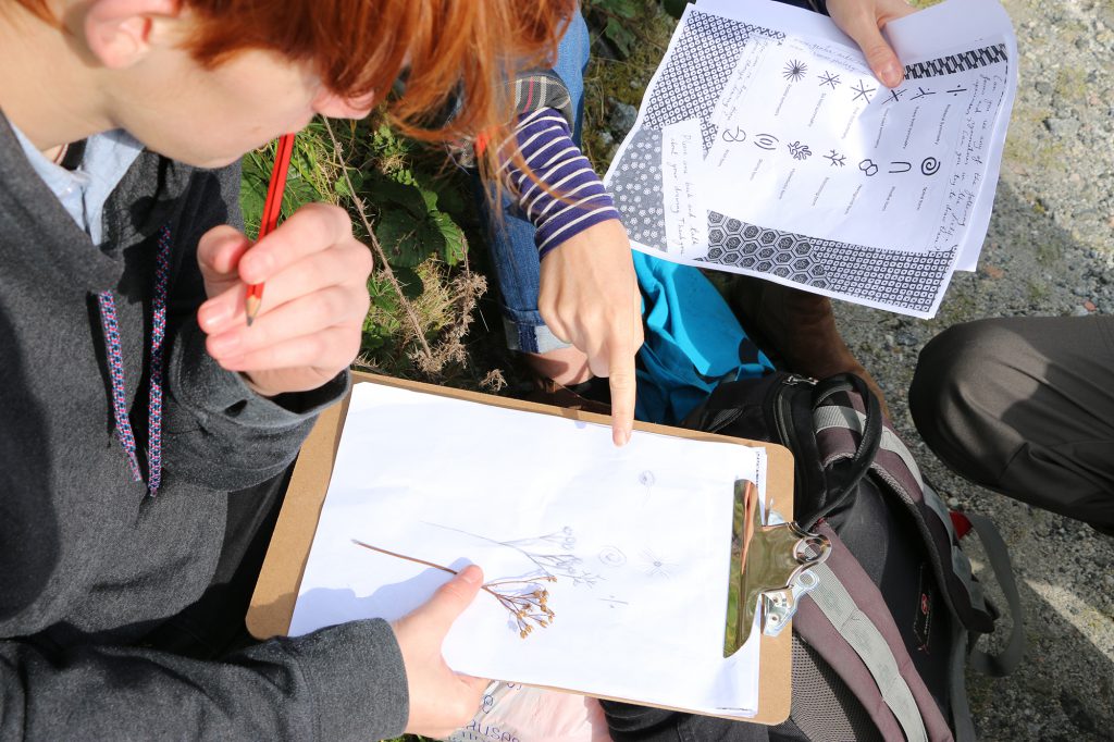 Students discussing a drawing