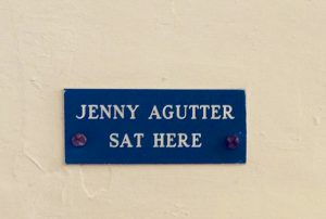 A sign on a wall, reading 'Jenny Agutter Sat Here'